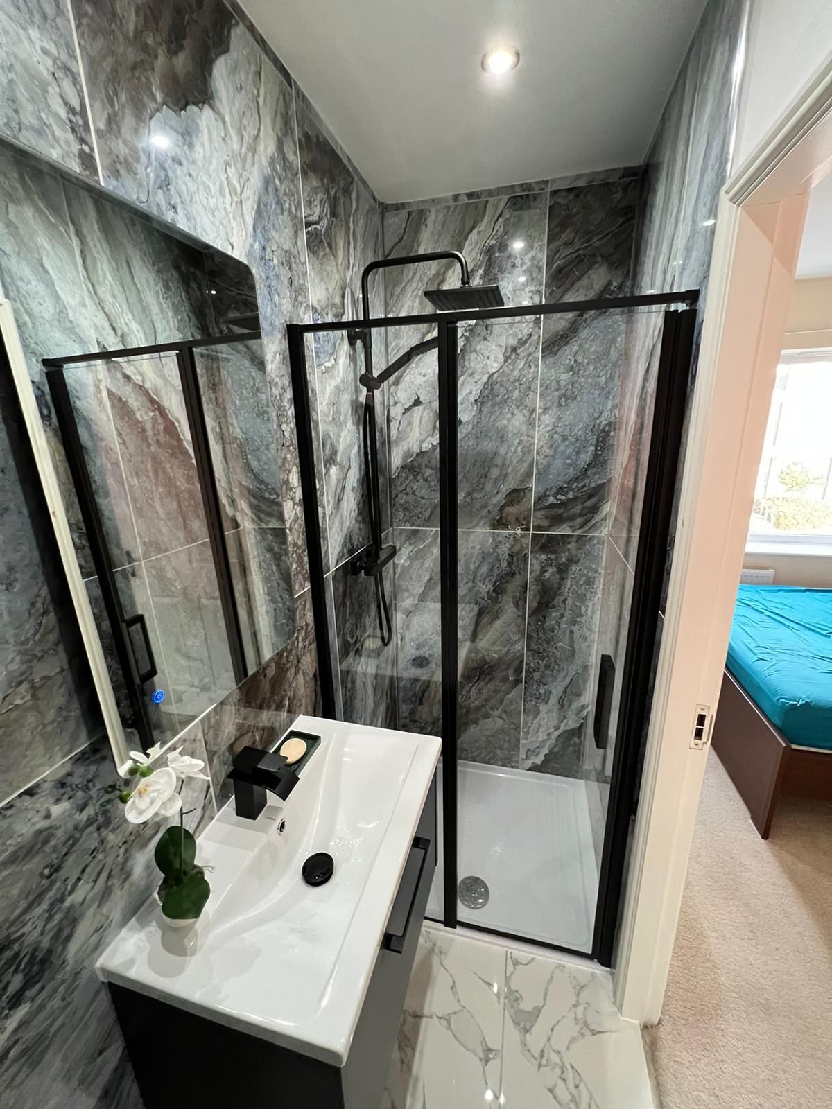 Modern bathroom with walk-in shower and vanity